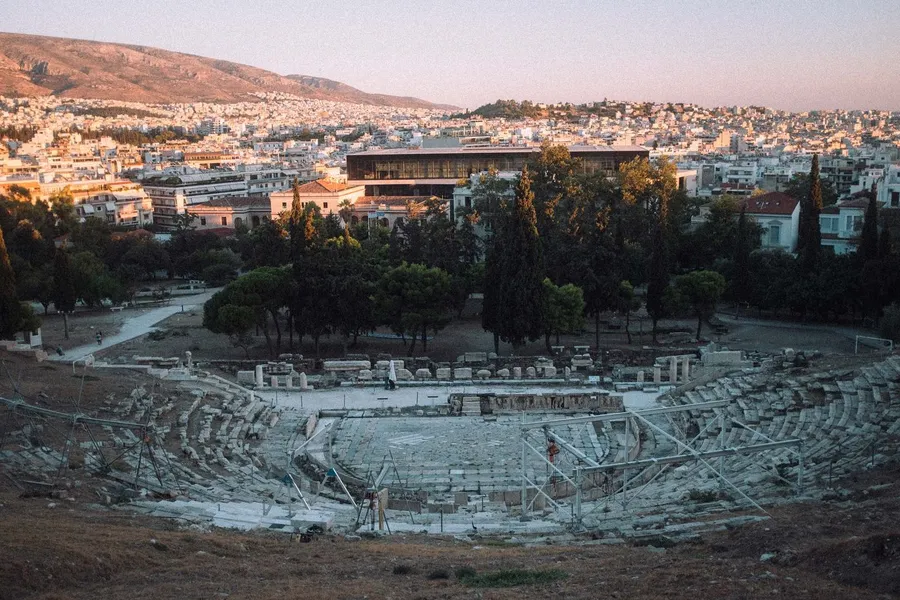 Ancient Theatre of Dionysus on the Acropolis slope overlooking the city, Athens, flash by Kilian Amrehn