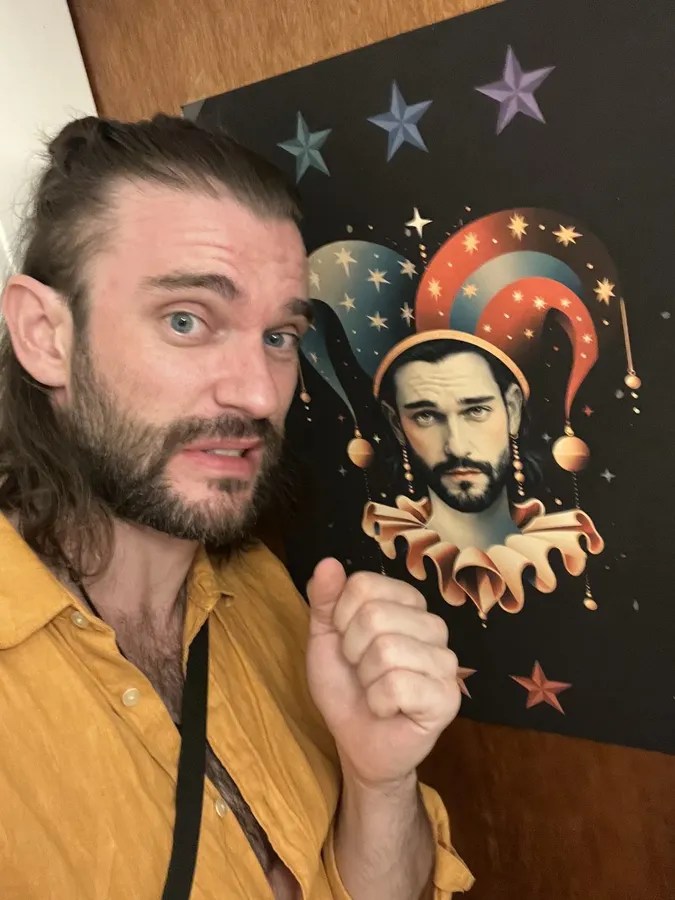 Man with a bun pointing at a picture of himself as a jester, starry background, flash by Kilian Amrehn