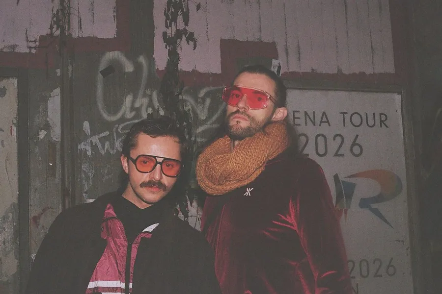 Analogue: two men in red sunglasses in front of a wall with graffiti and a poster, flash by Kilian Amrehn