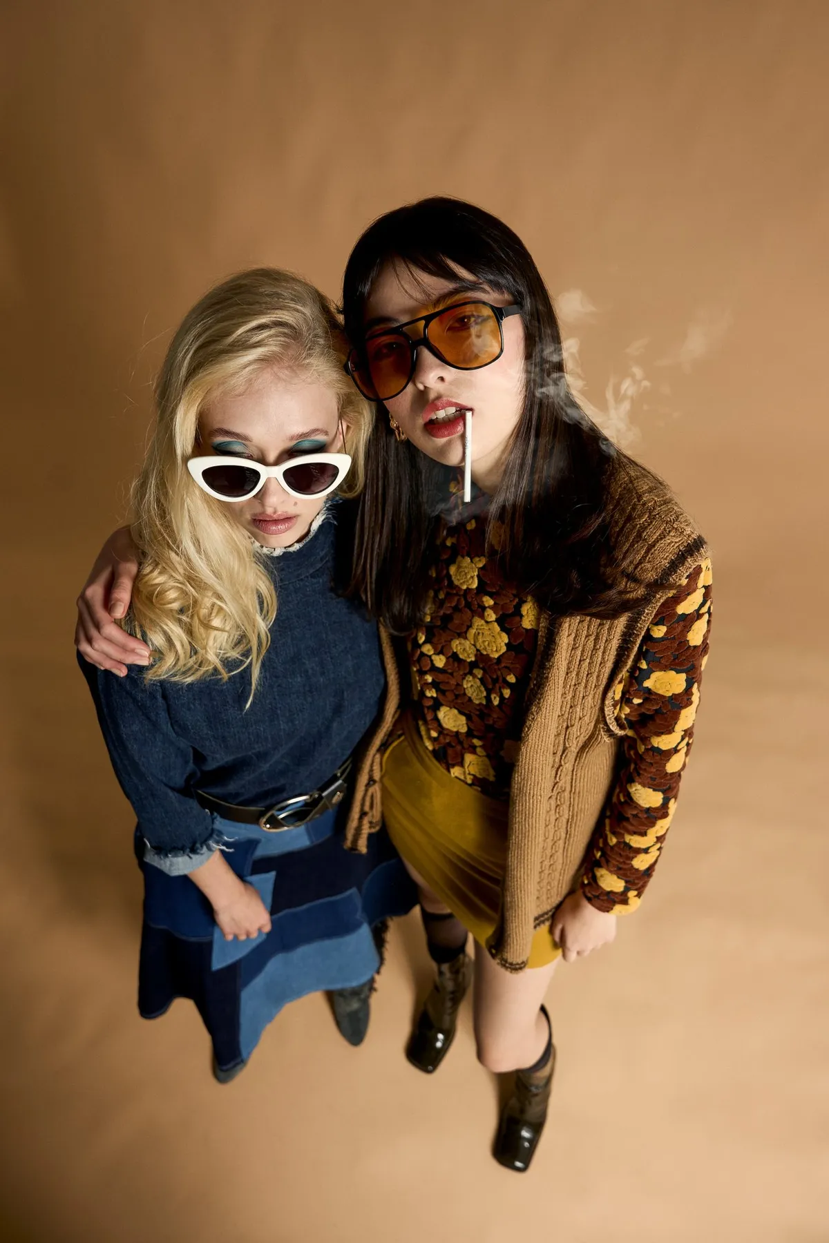 New Icons' Club Magazine, two models in retro sunglasses wearing vintage denim and patterned knits shot from above, editorial 2nd Hand 2024, photographed by Kilian Amrehn