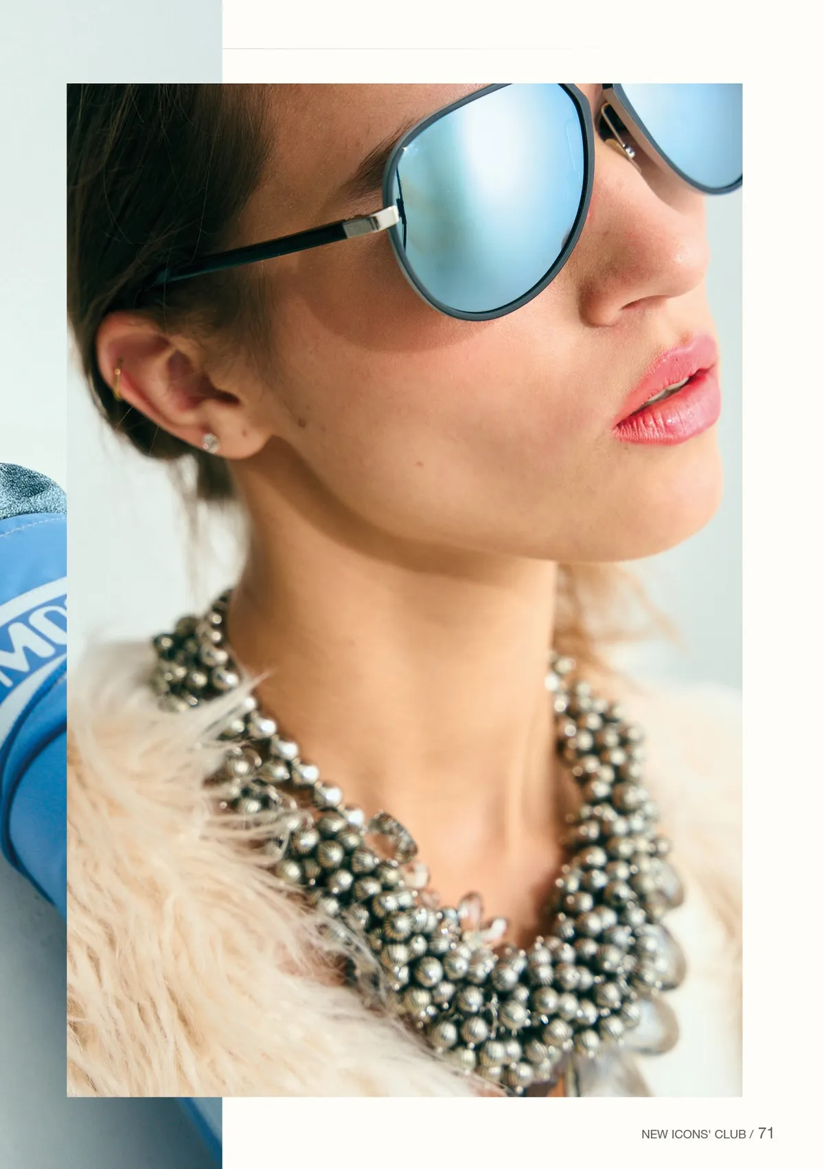 New Icons' Club Magazine, close-up of a model in mirrored blue aviators and an opulent beaded necklace, magazine page, editorial issue 1 2023, photographed by Kilian Amrehn