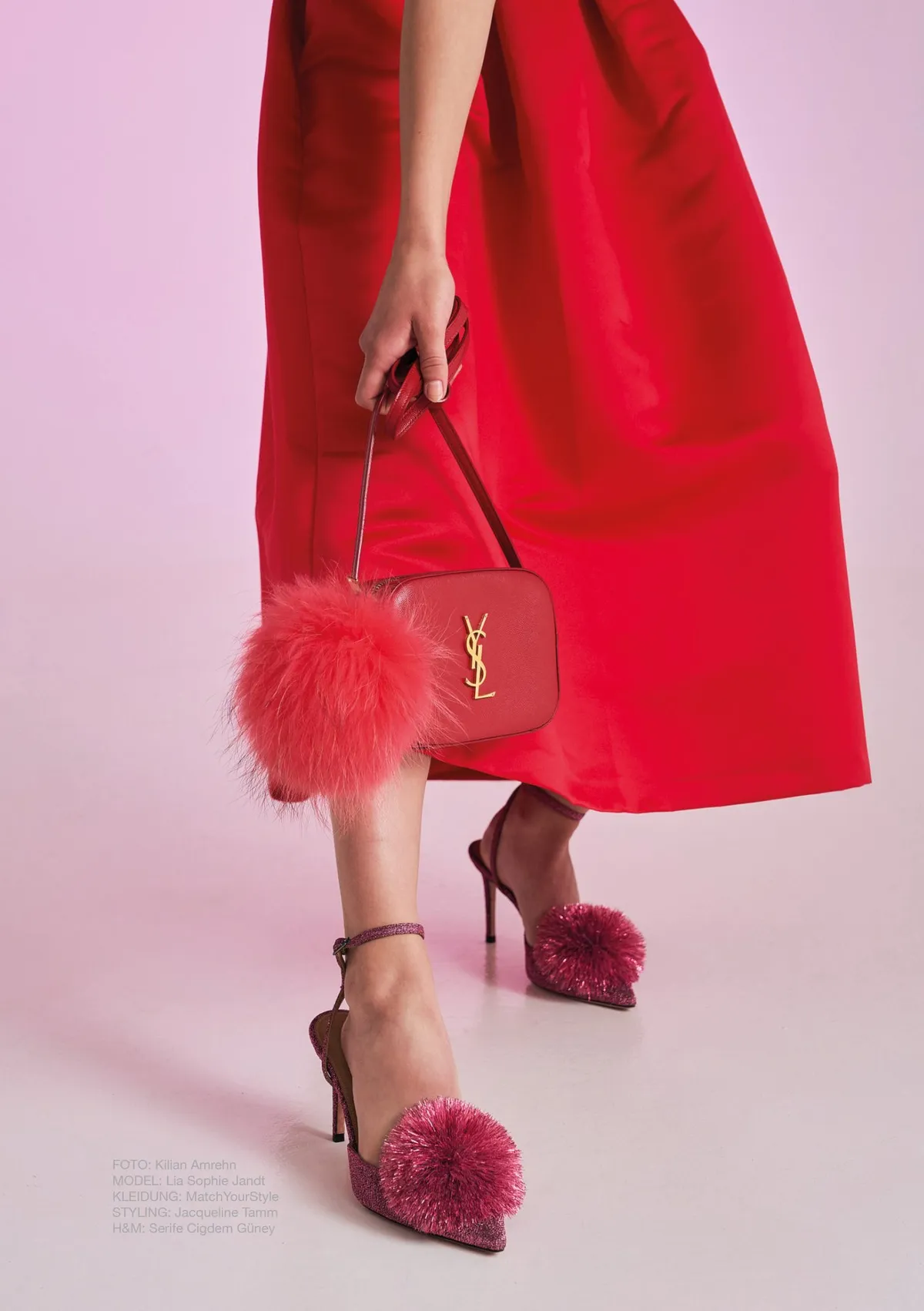 New Icons' Club Magazine, red skirt, red YSL bag with a pompom and heels with feather pompoms against pink, editorial issue 1 2023, photographed by Kilian Amrehn