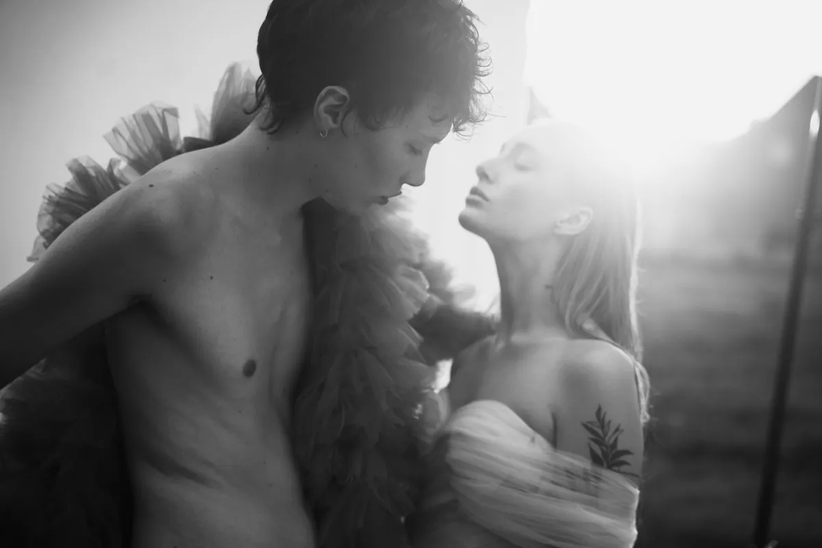 Rock Fairyland, two models close together in backlight, tulle details in black and white with bright sunshine, editorial 2021, photographed by Kilian Amrehn